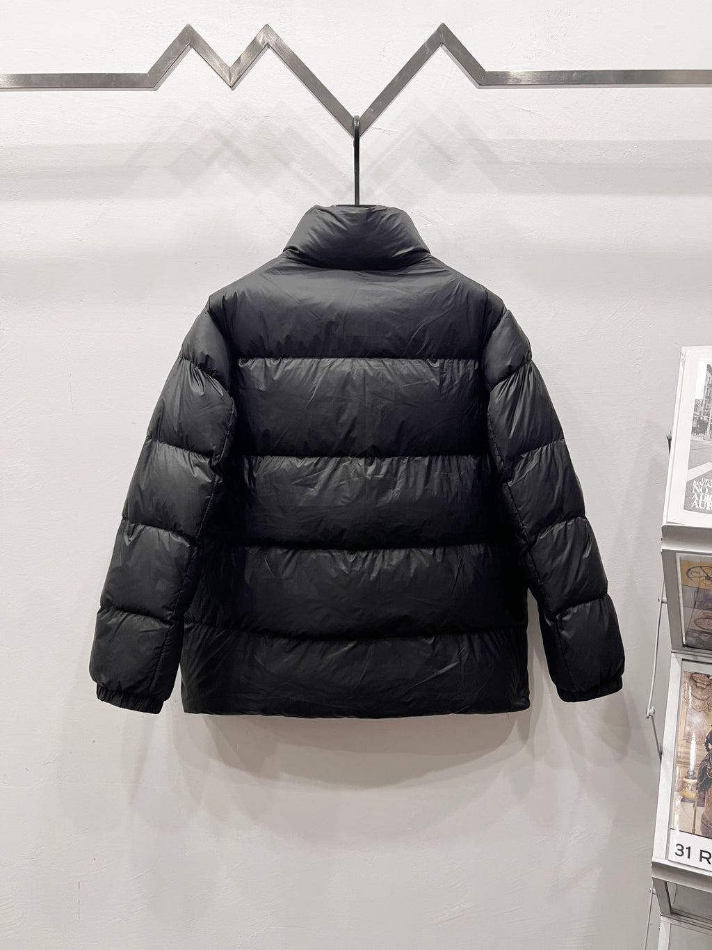 Moncler long puffer jacket back view, dark quilted with stand collar