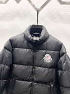 Moncler long puffer jacket with chest logo patch and stand collar