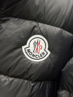 Moncler logo patch on dark quilted puffer jacket