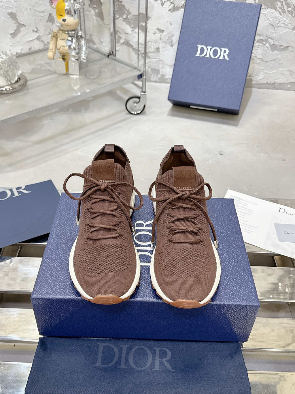 Unisex knit sneakers in brown with lace-up front and white rubber sole