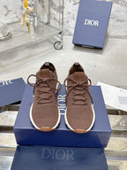 Unisex knit sneakers in brown with lace-up front and white rubber sole