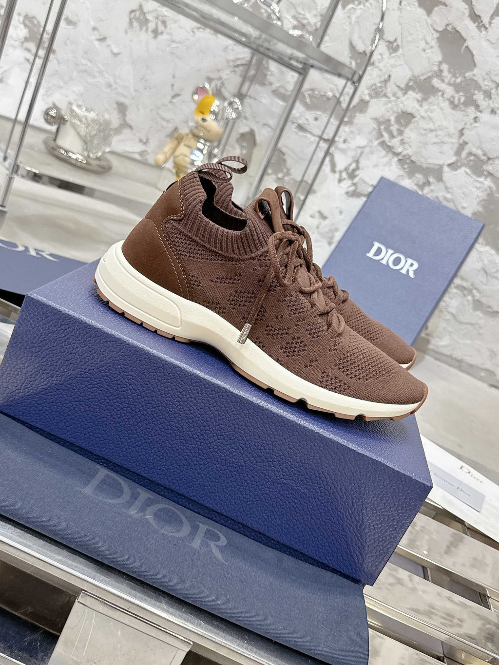 Brown lace-up knit sneaker with sculpted white outsole tread