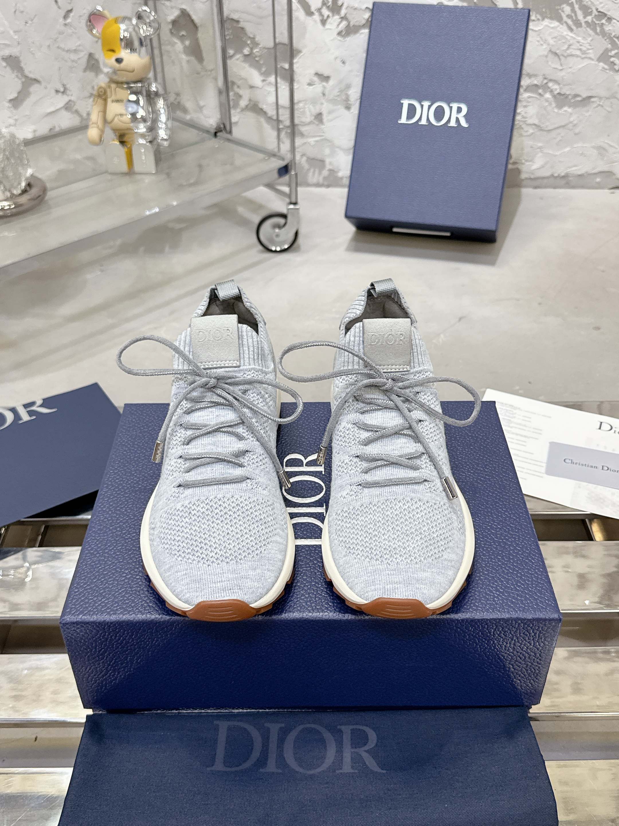 Unisex light gray knit lace-up sneakers with textured gum sole