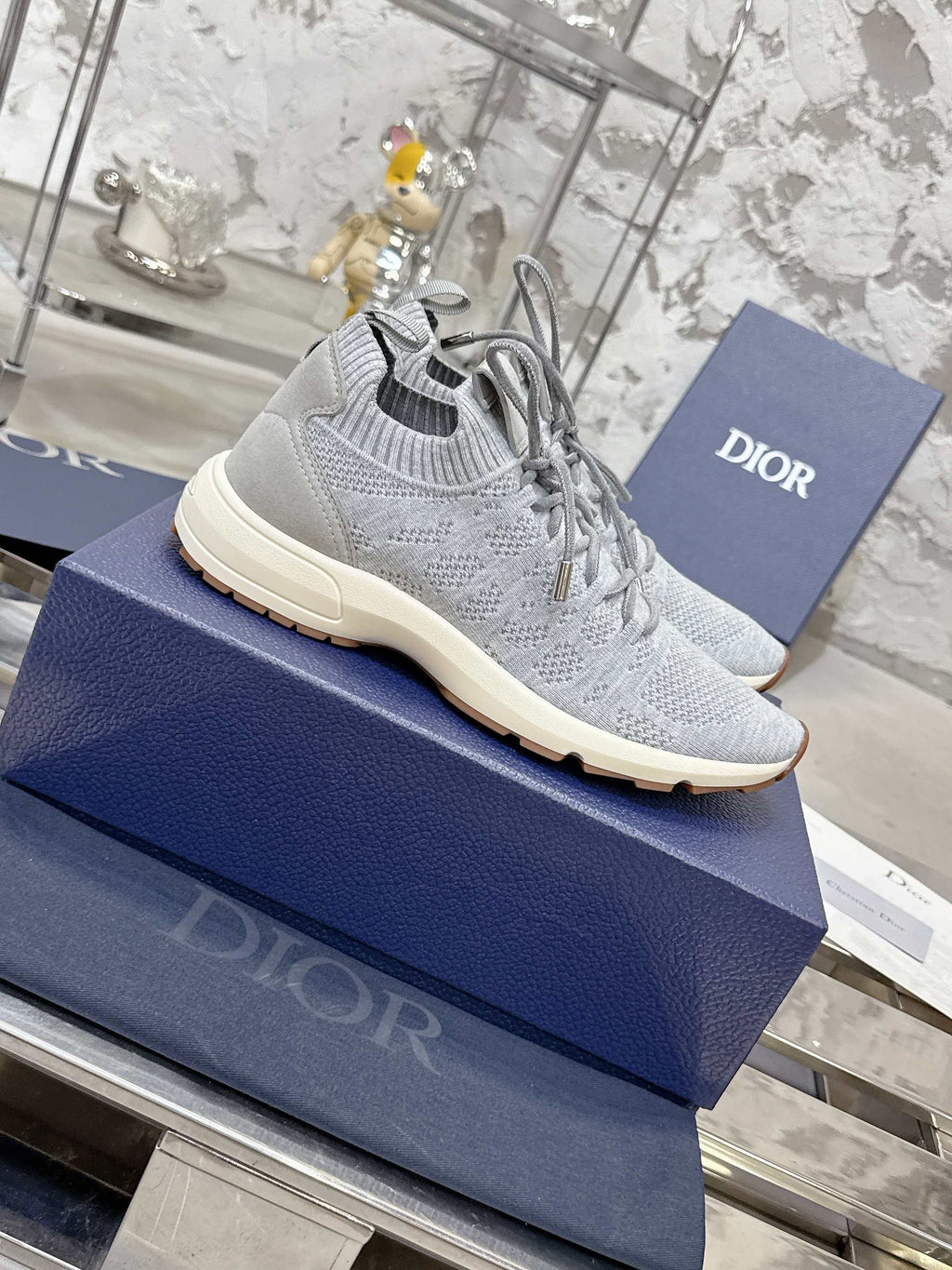 Unisex light gray knit lace-up sneaker with cream sole and tread