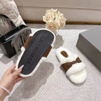 Balenciaga sandal outsole in dark textured rubber with white teddy upper and brown strap