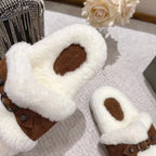 Balenciaga close-up of white teddy slide sandal with brown leather strap and studs