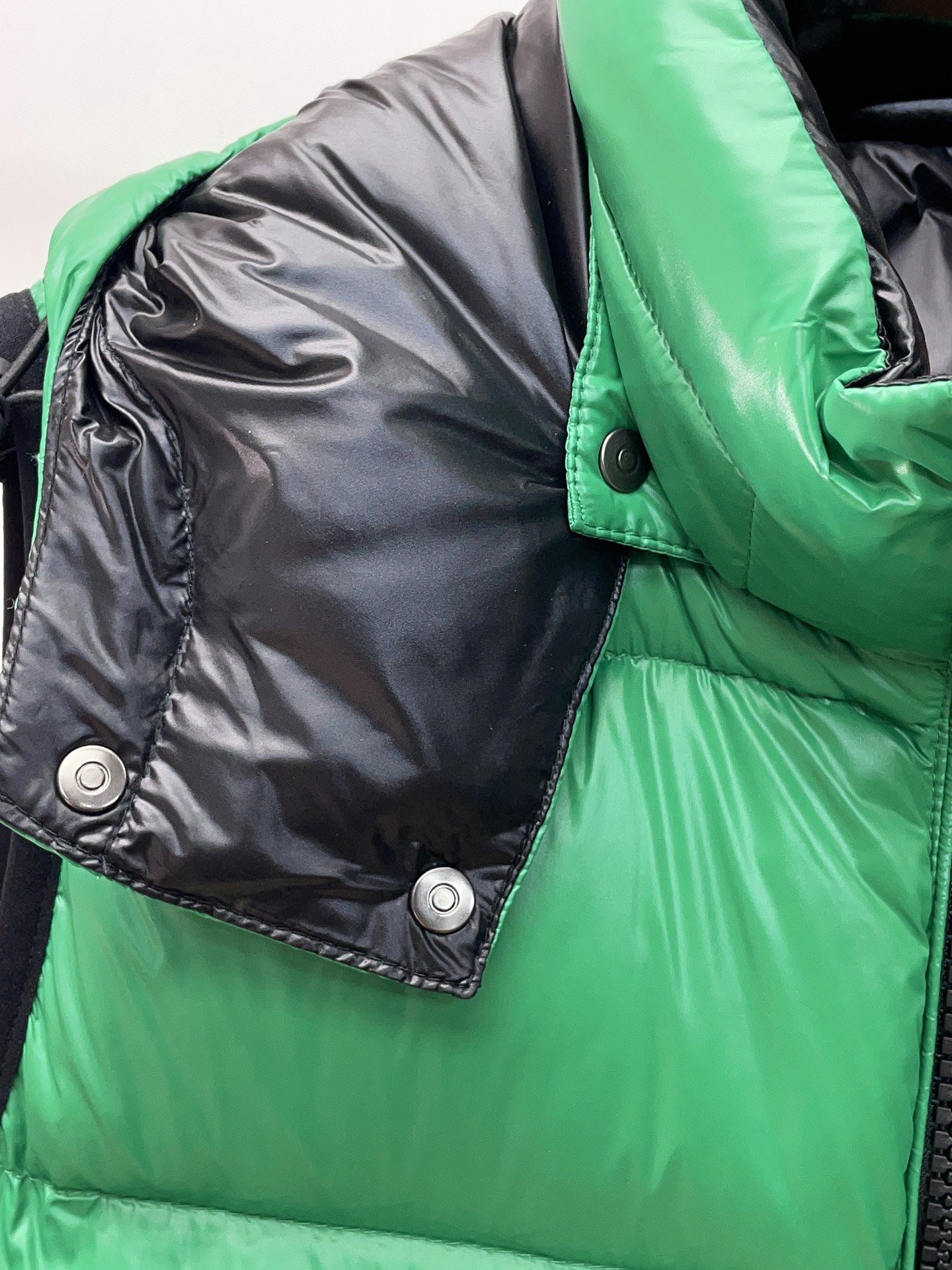 Green and gray long jacket with snap buttons and quilted panels