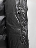 Dark gray long jacket with front zipper and zipper pull tab