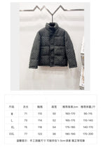 Dark gray long puffer jacket on hanger with size chart table