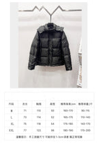 Black long puffer jacket on display with size chart panel