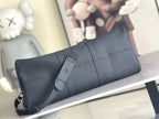 Men's Louis Vuitton duffel bag with wide strap and top handle, side view