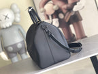 Men's Louis Vuitton duffel bag with curved top handle and adjustable shoulder strap