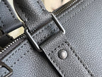 Louis Vuitton duffel bag close-up of textured leather, stitching, and logo stamp