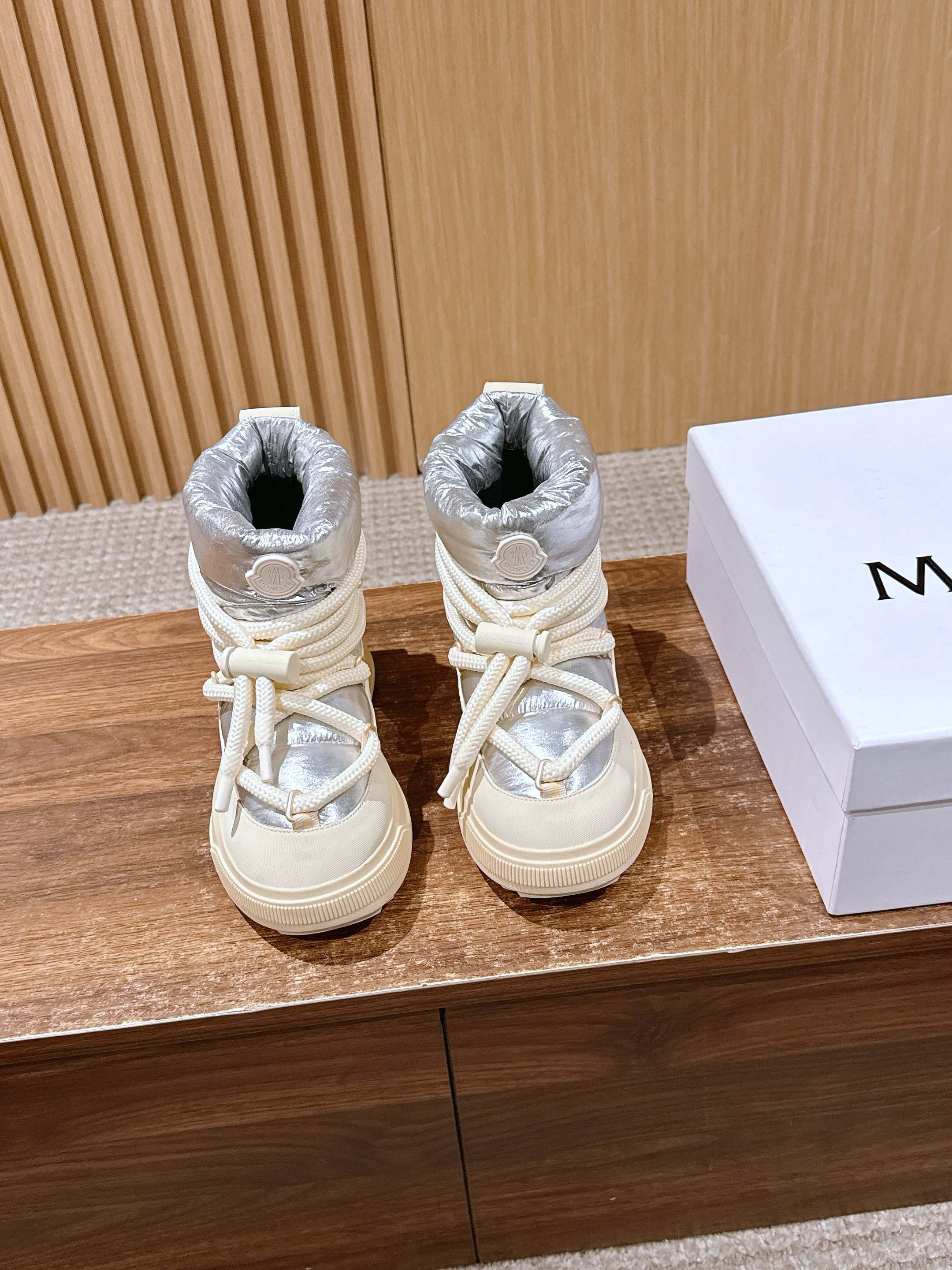 Moncler lace-up sneaker boots with silver padded uppers and cream laces