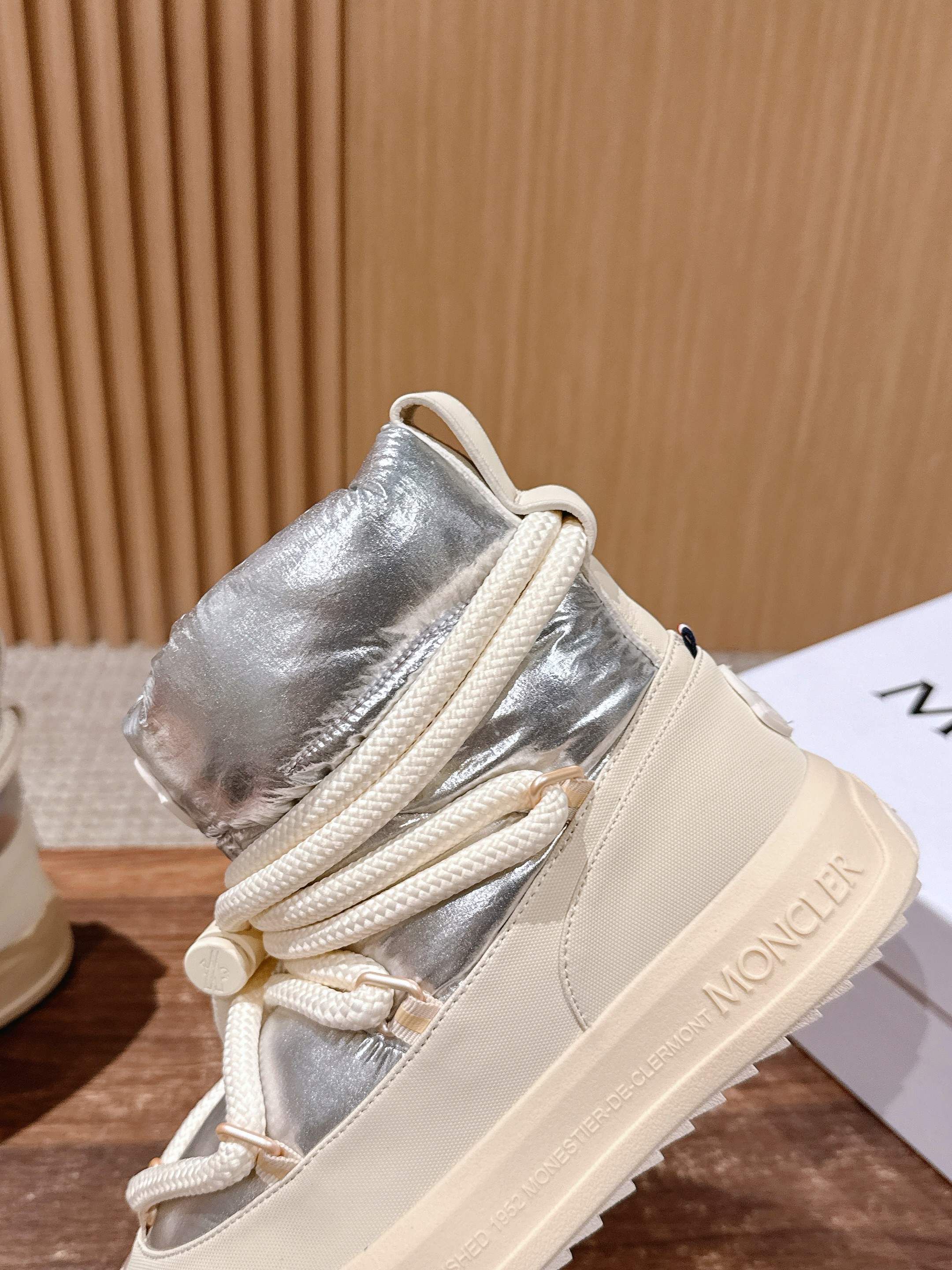 Moncler lace-up sneaker boot with silver padded upper and heel-side branding