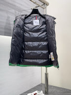 Black interior lining of a puffer vest with front zipper and hood opening