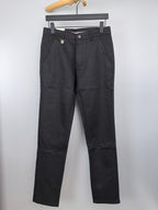 Black Burberry trousers on hanger, front view with belt loops and button closure