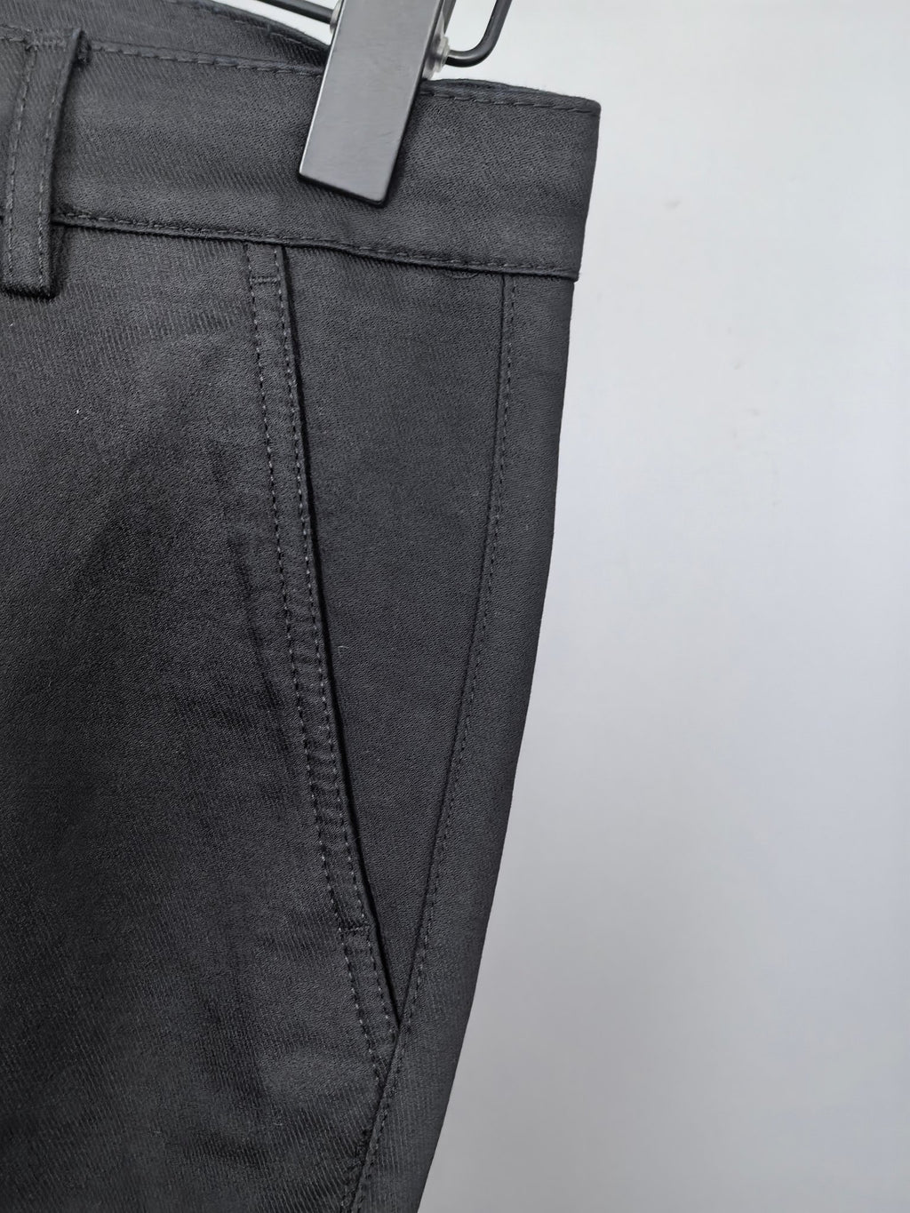 Black Burberry trouser front pocket and side seam detail