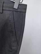Black Burberry trouser front pocket and side seam detail