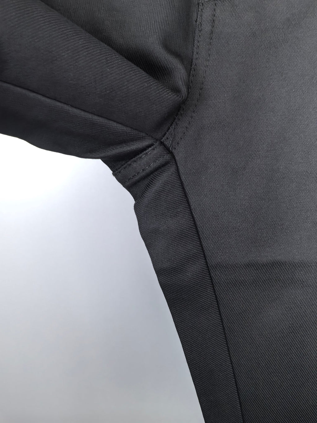 Black Burberry trouser seat seam and leg panel detail
