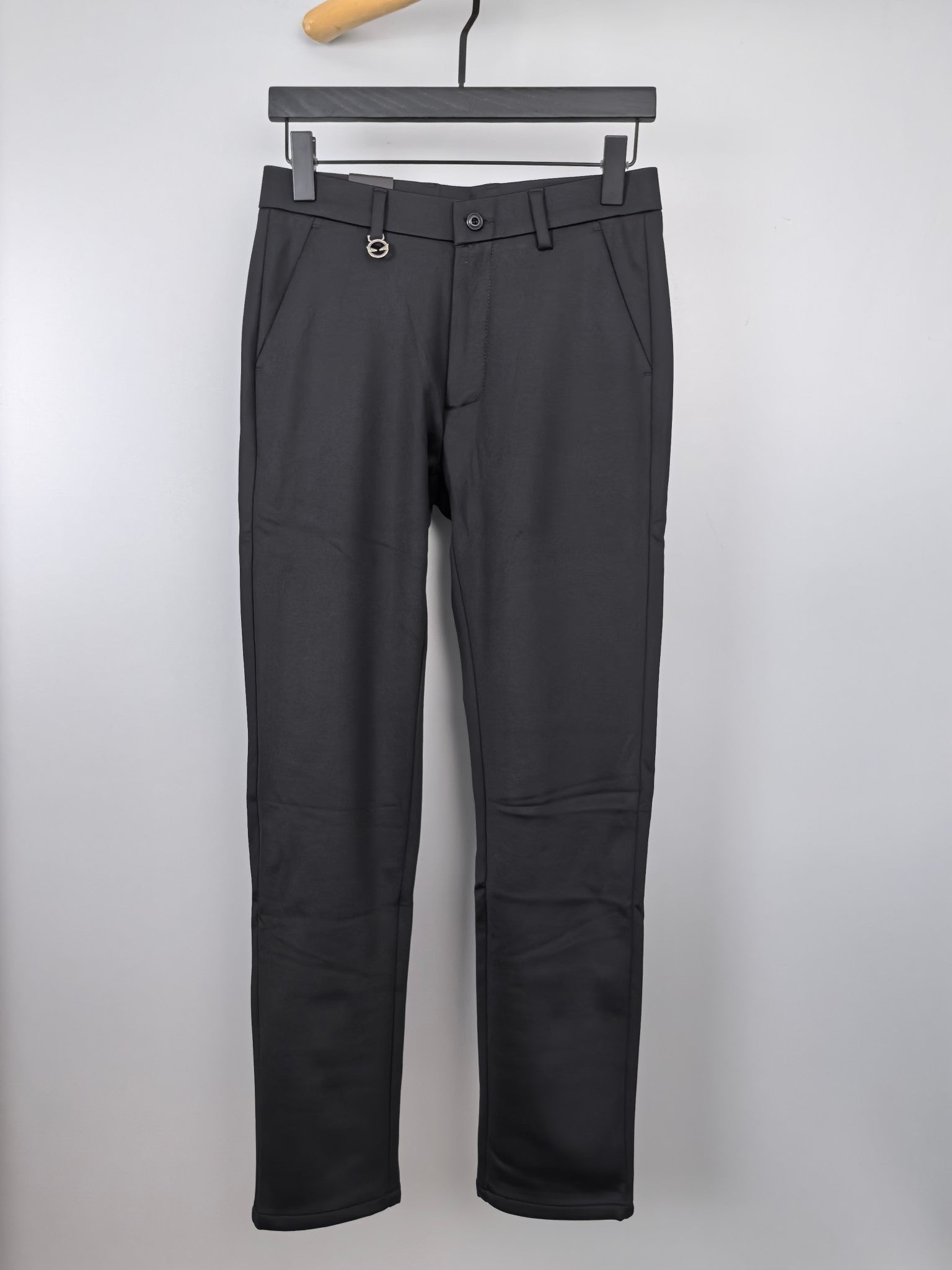 Black button-waist trousers with belt loops and side pockets