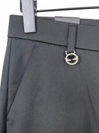 Black trousers with logo d-ring belt detail and slanted side pockets