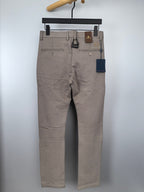 Beige dress pants hanging front view with straight legs and belt loops