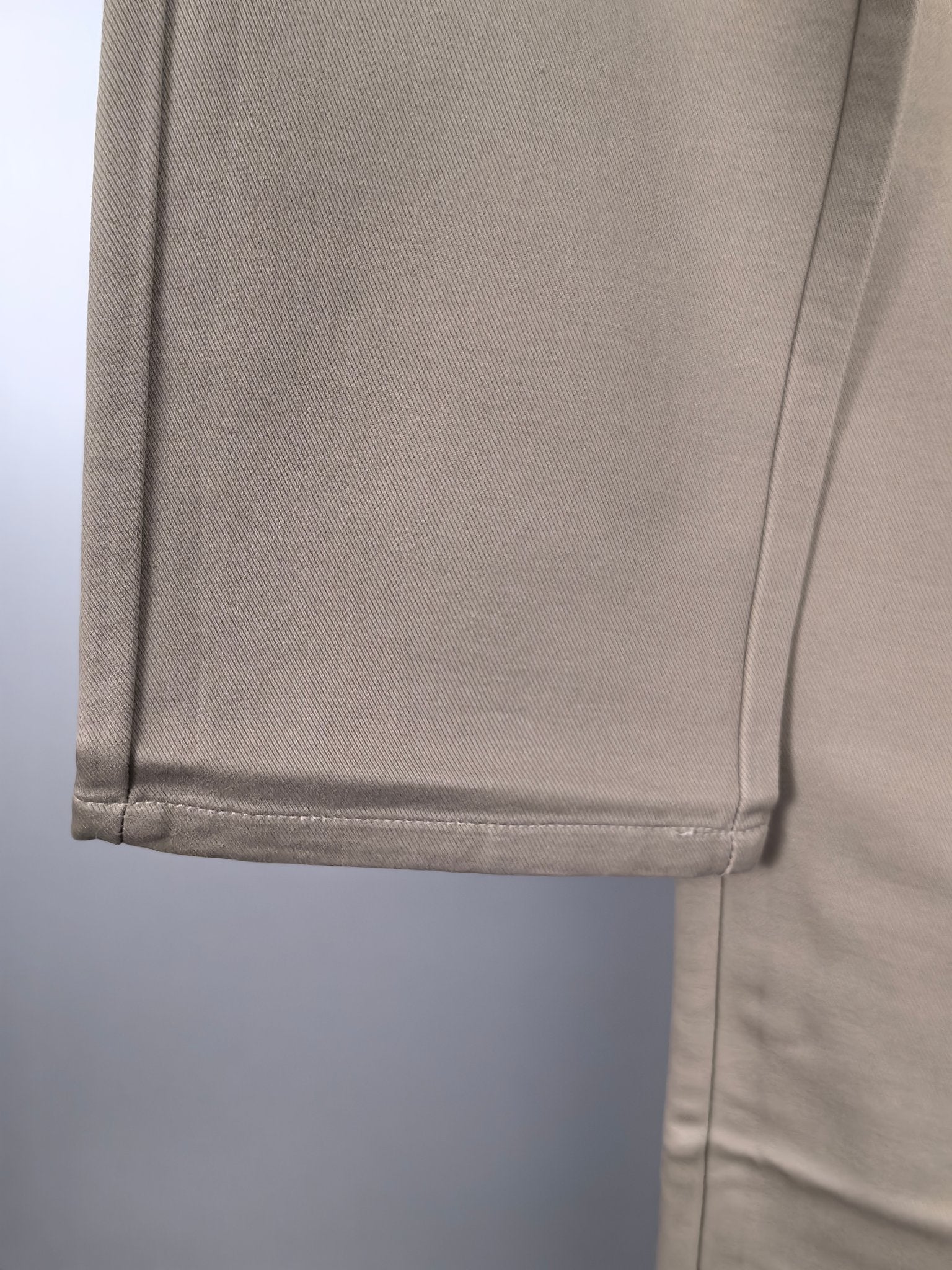 Beige Gucci pants hem with stitched cuff