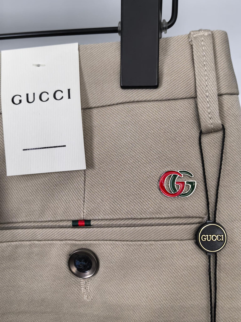 Beige Gucci pants waistband with GG logo detail and belt loop