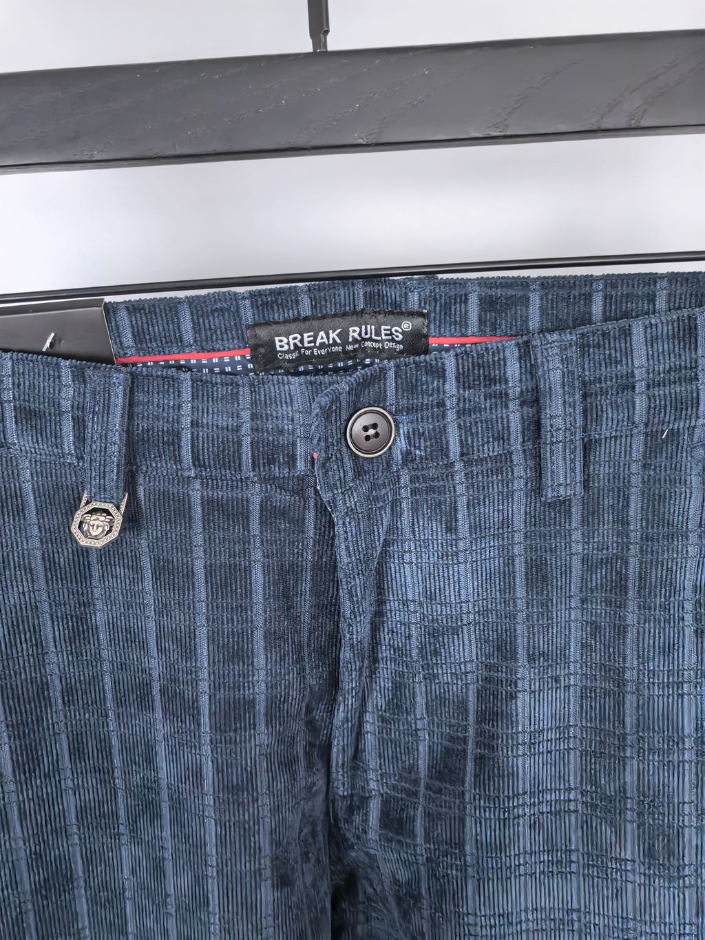 Blue check trousers waistband with button fly and logo patch