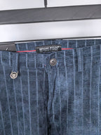 Blue check trousers waistband with button fly and logo patch