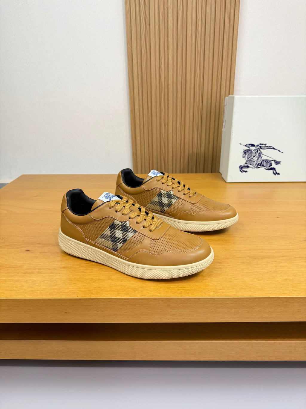 Tan leather sneakers with lace-up front, Burberry check side panel, and white sole
