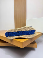 Sneaker outsole with blue tread and light rubber pattern