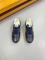 Pair of Burberry low-top sneakers in dark navy with lace-up front and check panel
