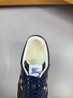 Burberry low-top sneaker close-up on insole with navy lining and check accent