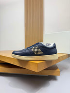 Burberry low-top sneaker in navy with check panel strap and textured white outsole