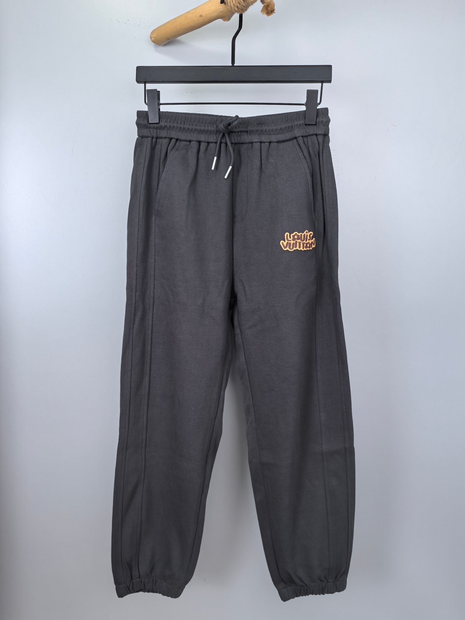 Dark gray Louis Vuitton drawstring jogger pants with front patch pockets
