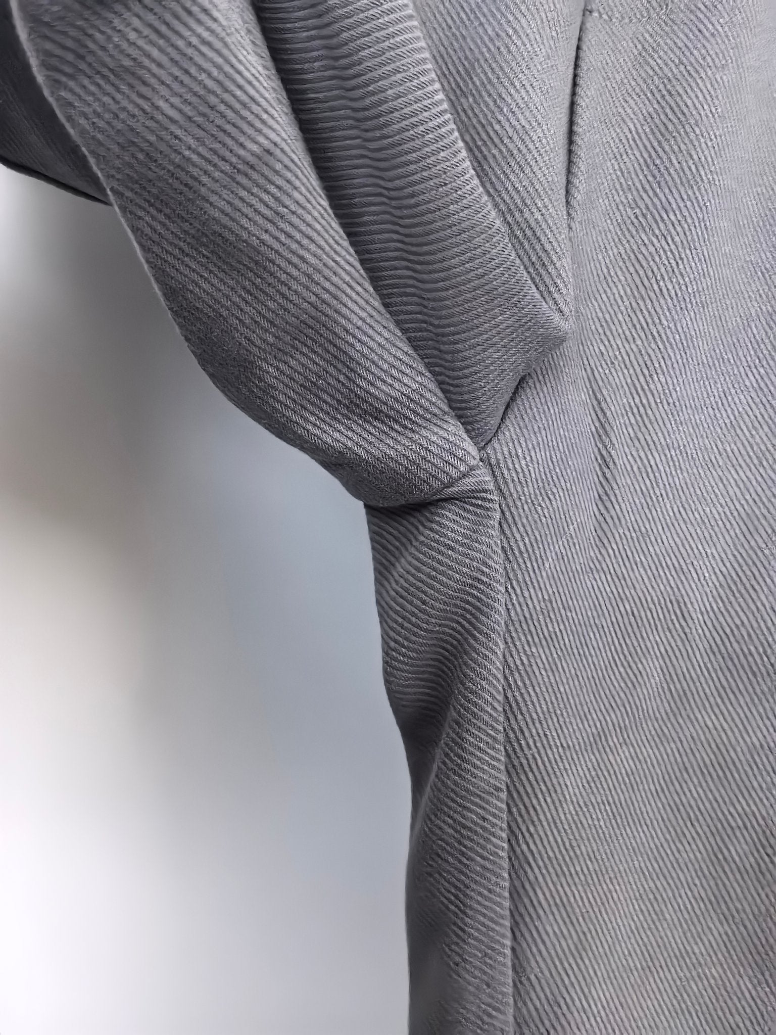 Dark gray Louis Vuitton jogger pants with draped fabric and cuffed leg opening