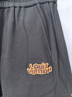 Dark gray Louis Vuitton jogger pants with embroidered logo on front pocket