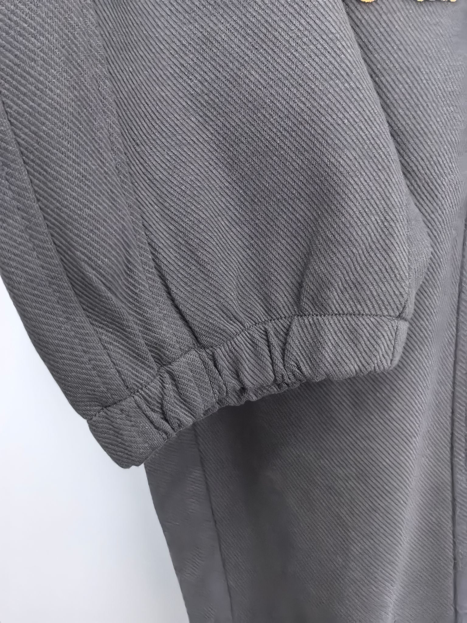 Dark gray Louis Vuitton jogger pants with gathered cuff hem and seam detail