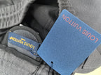 Dark gray Louis Vuitton jogger pants with inside waistband label and blue tag