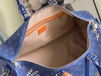 Louis Vuitton duffel bag interior view with beige lining and zip pocket in blue exterior