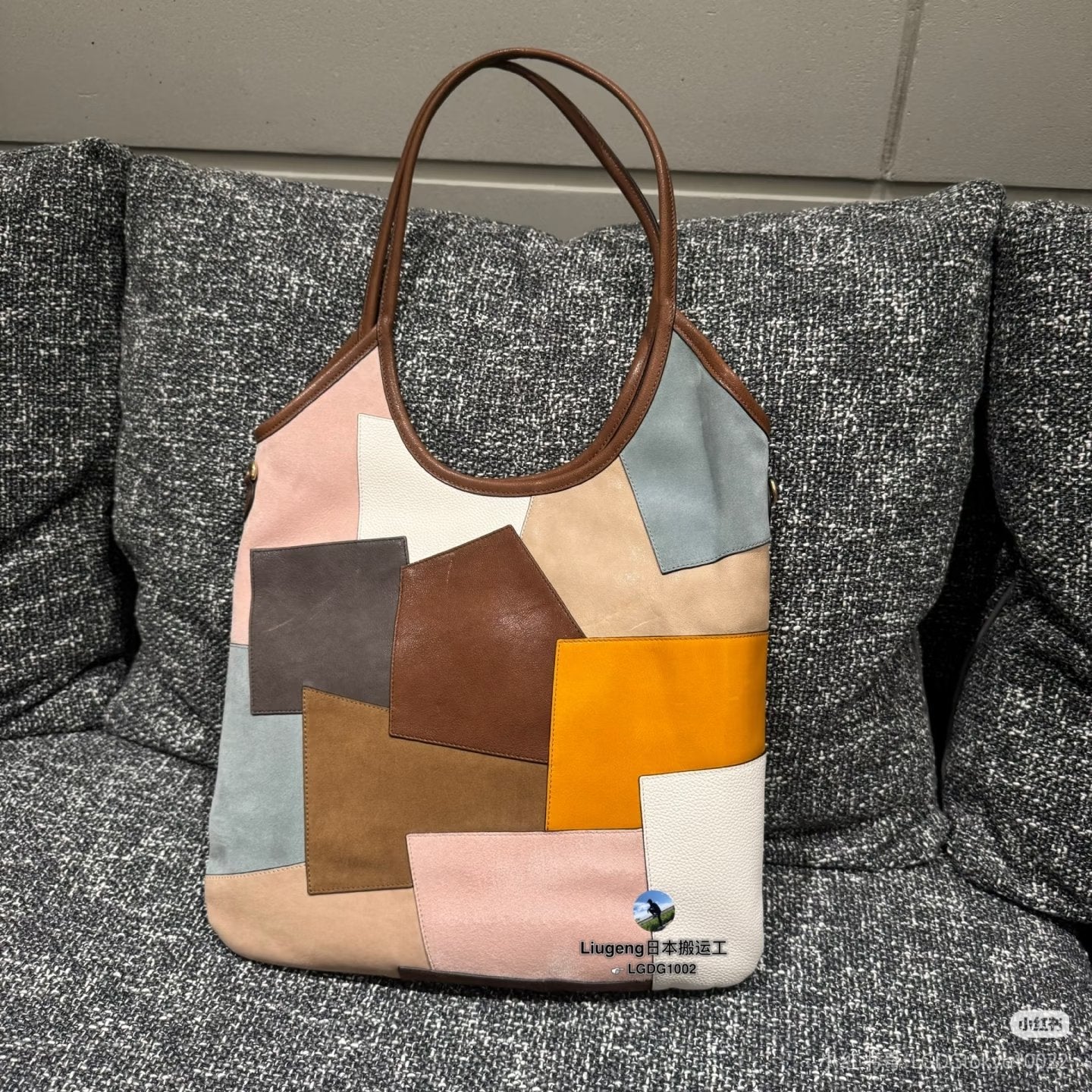 MiuMiu patchwork tote bag with brown top handles and Miu Miu logo on front
