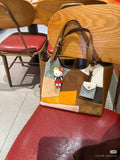 MiuMiu patchwork tote bag, brown/gray/tan with orange panel; small charm and tag
