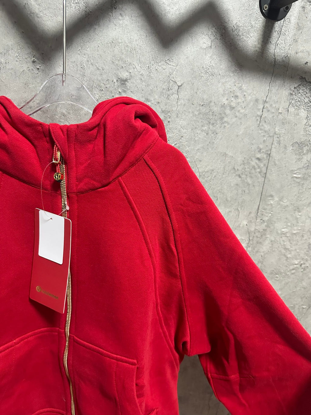 Ralph Lauren red zip hoodie angled view of hood and front pocket