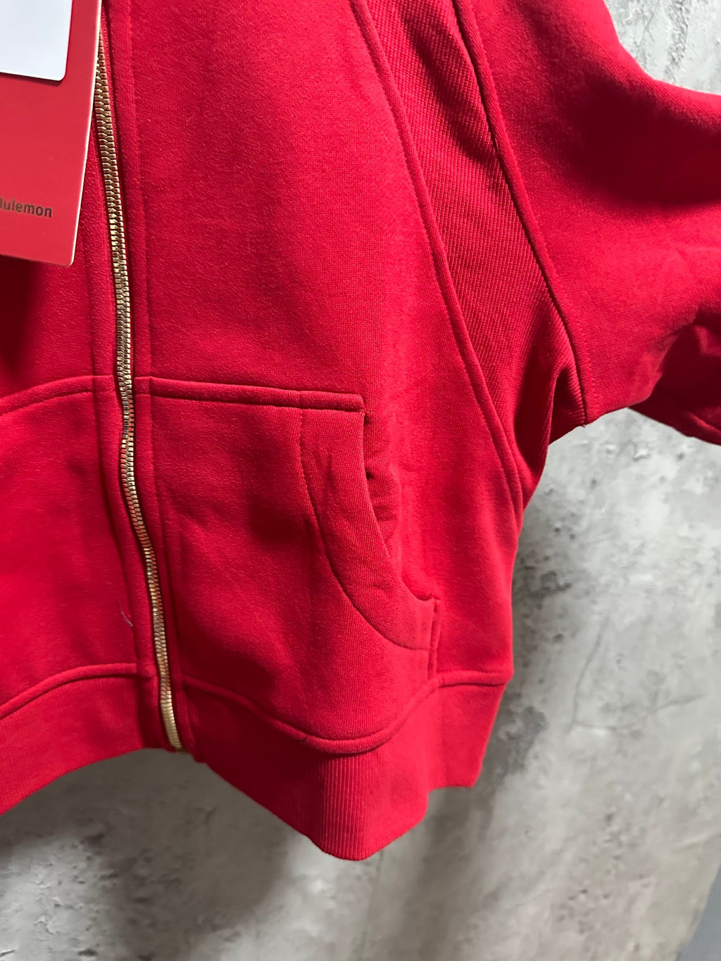 Ralph Lauren red zip hoodie sleeve and front pocket detail