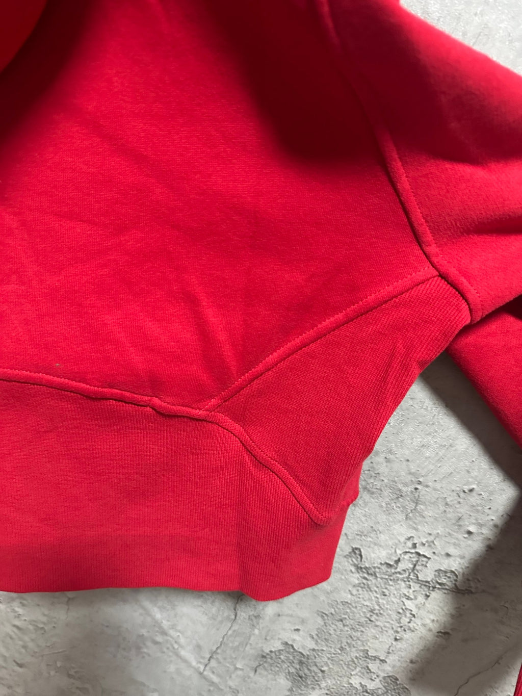 Ralph Lauren red zip hoodie fabric and seam detail near hem