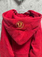 Ralph Lauren red zip hoodie close-up of hood with gold emblem