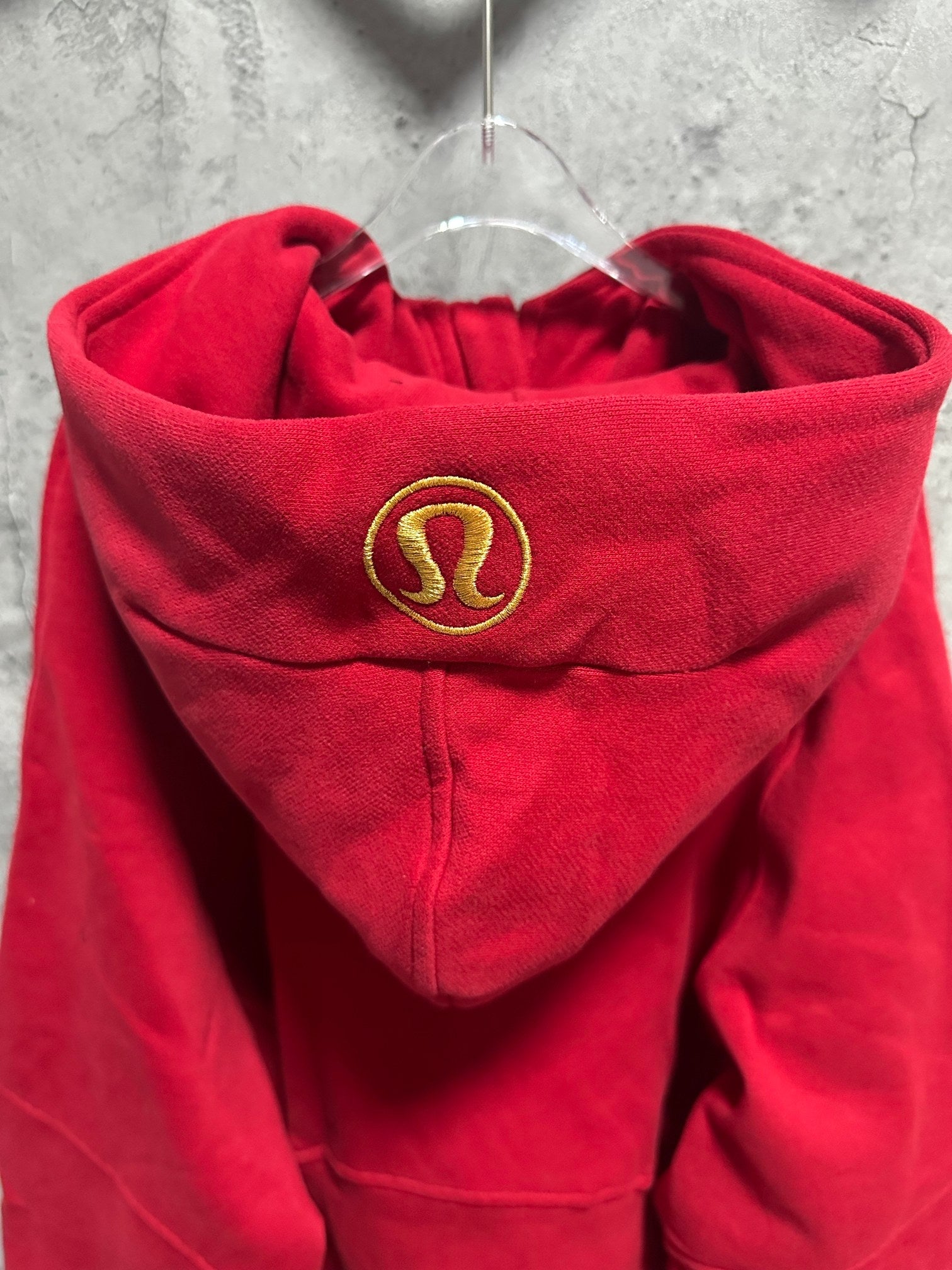 Ralph Lauren red zip hoodie close-up of hood with gold emblem