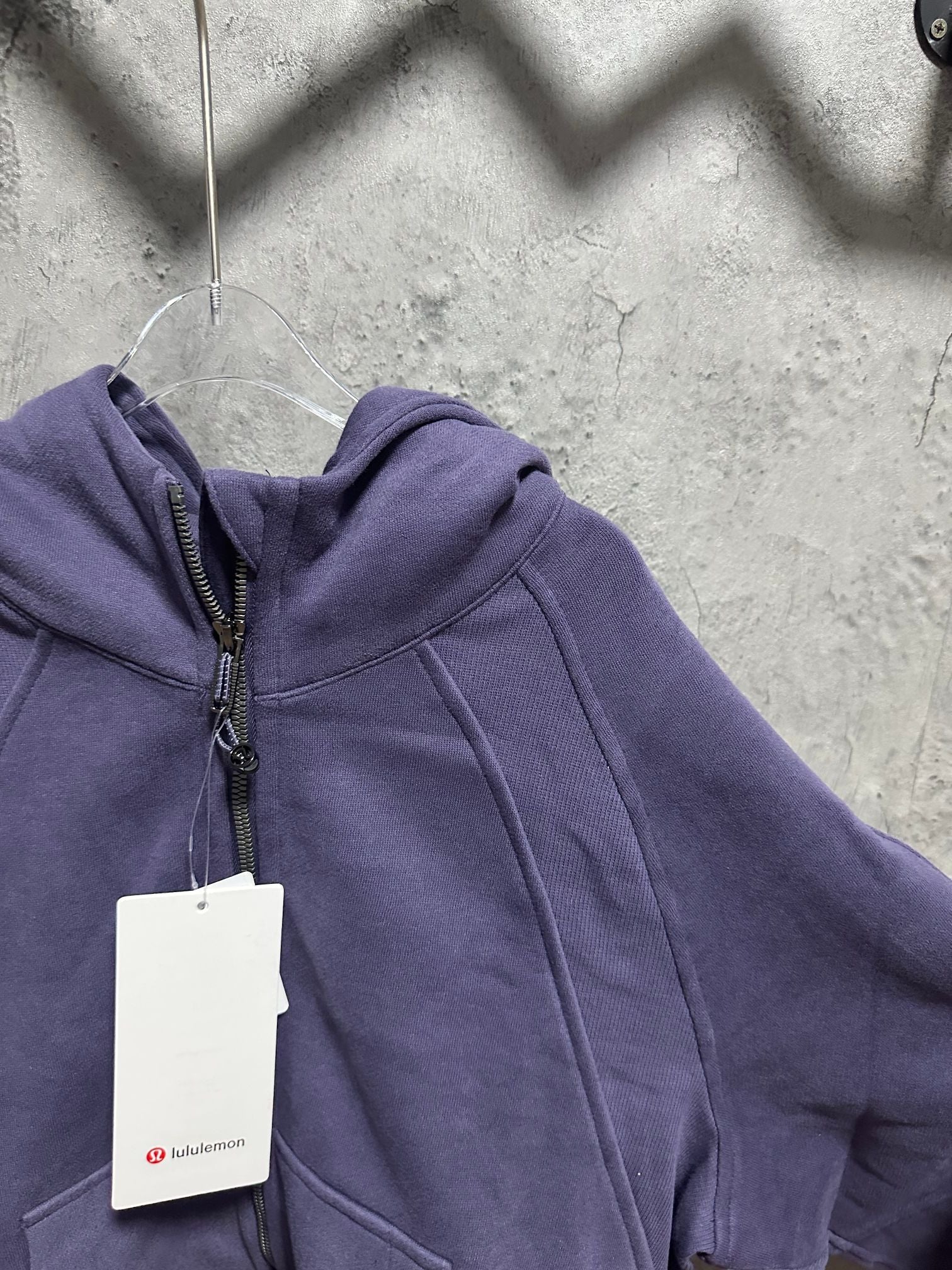 Ralph Lauren zip-up hoodie in dark purple; close view of hood and zipper